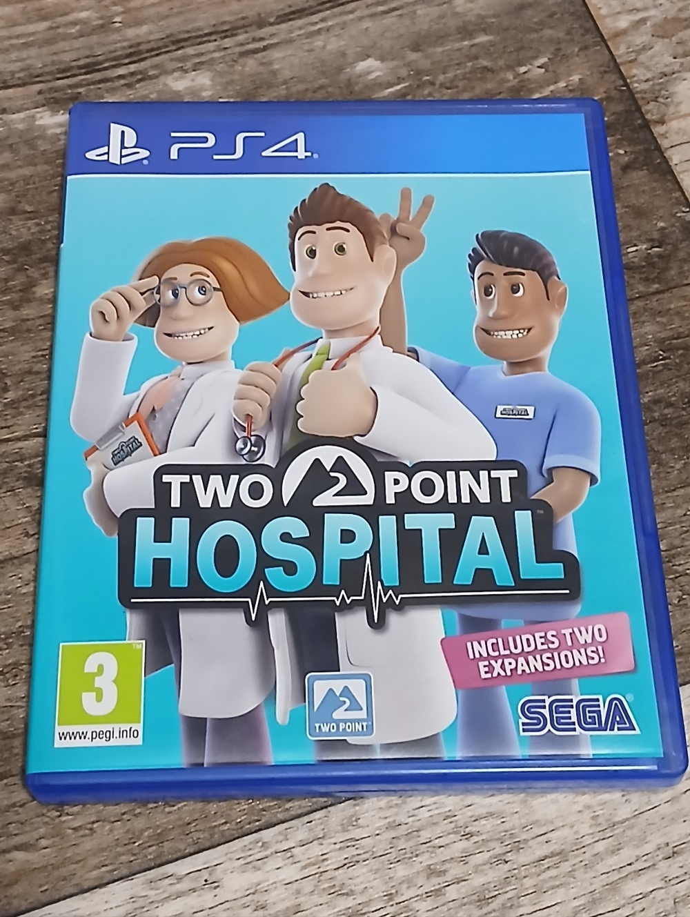 Two Point Hospital PS4 Game - Blue Case